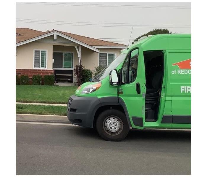 SERVPRO cargo truck parked in front of family home