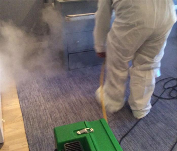 SERVPRO worker destroying odors